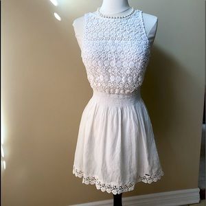 Beautiful white pretty summer dress. Low back, pretty lace covered front top.